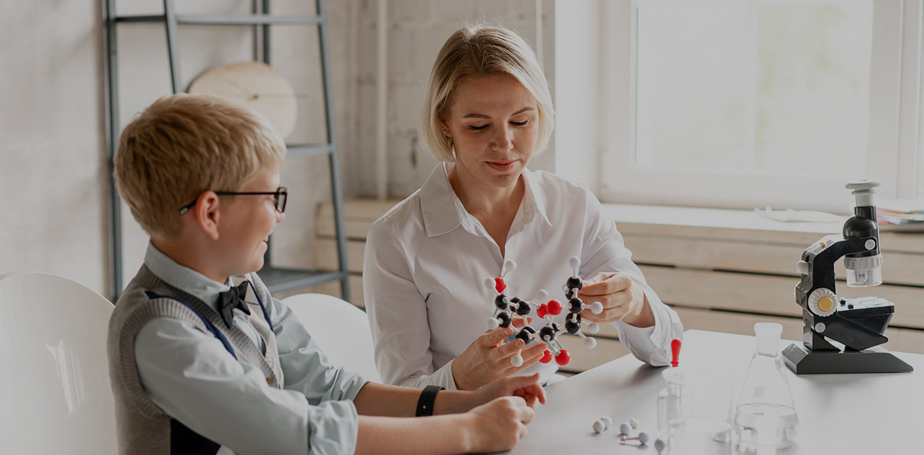 Female science tutor in Deer Park studying chemistry with student